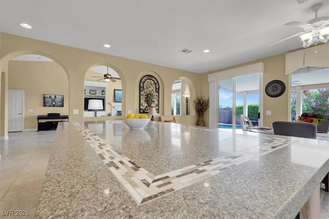 8608 Willow Cabin St, Las Vegas, NV 89131 - kitchen featuring a ceiling fan, open floor plan, recessed lighting, a spacious island, and light tile patterned floors