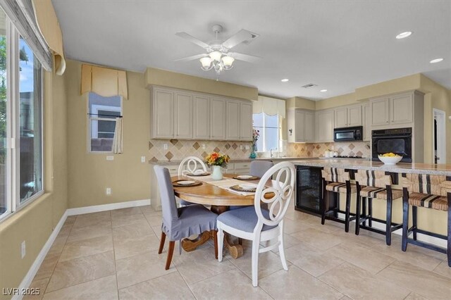 8608 Willow Cabin St, Las Vegas, NV 89131 - dining space with baseboards, a ceiling fan, light tile patterned floors, and recessed lighting