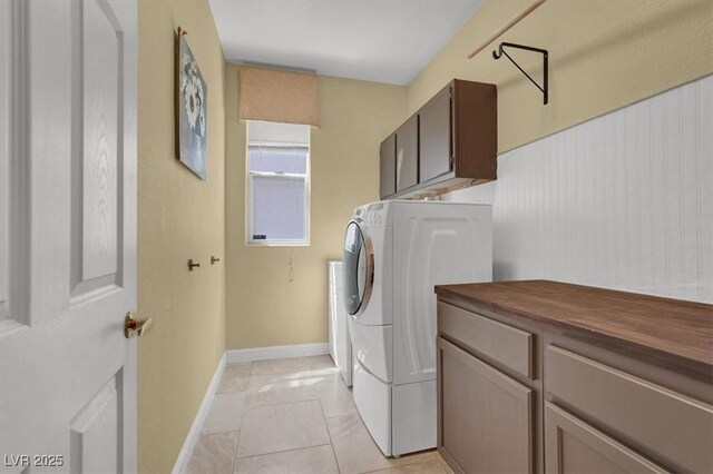 8608 Willow Cabin St, Las Vegas, NV 89131 - washroom featuring cabinet space, baseboards, and separate washer and dryer