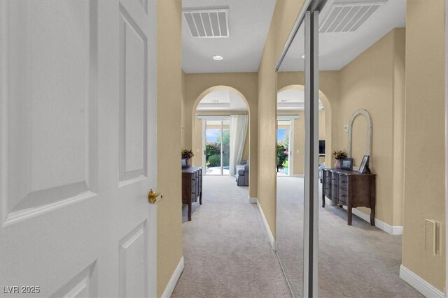 8608 Willow Cabin St, Las Vegas, NV 89131 - hallway with arched walkways, carpet flooring, and baseboards