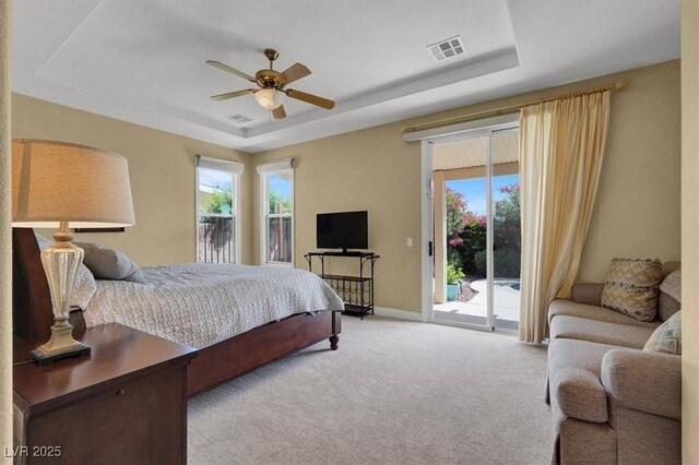 8608 Willow Cabin St, Las Vegas, NV 89131 - bedroom with a raised ceiling, access to outside, multiple windows, and carpet flooring