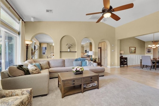 8608 Willow Cabin St, Las Vegas, NV 89131 - living area with arched walkways, a chandelier, lofted ceiling, and ceiling fan