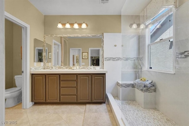 8608 Willow Cabin St, Las Vegas, NV 89131 - full bathroom featuring toilet, tile patterned floors, and double vanity