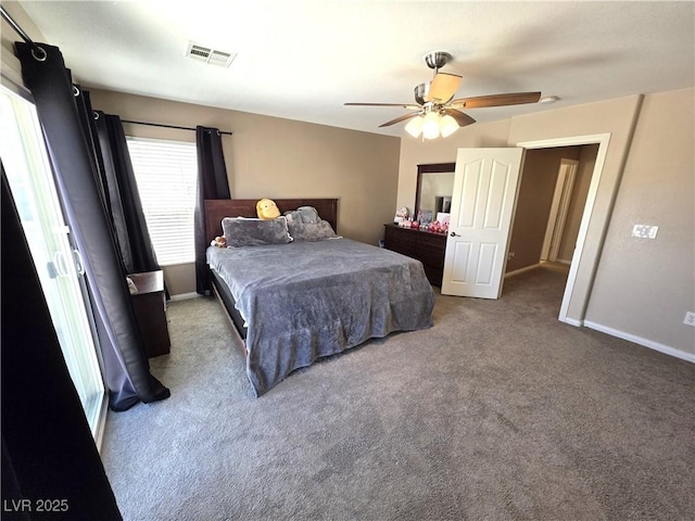 carpeted bedroom featuring baseboards and a ceiling fan