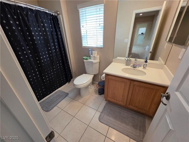full bathroom featuring tile patterned flooring, toilet, vanity, and curtained shower