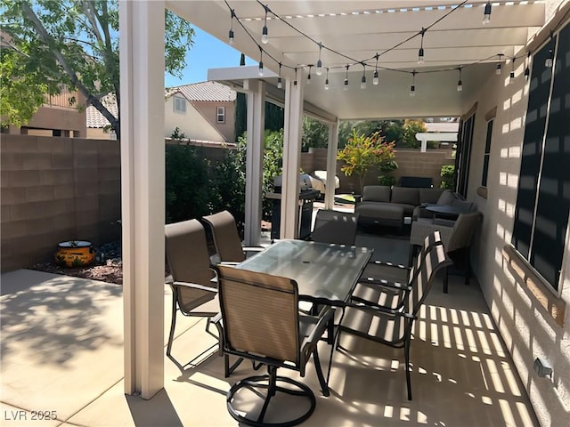 fenced backyard with an outdoor living space, a patio area, and outdoor dining space