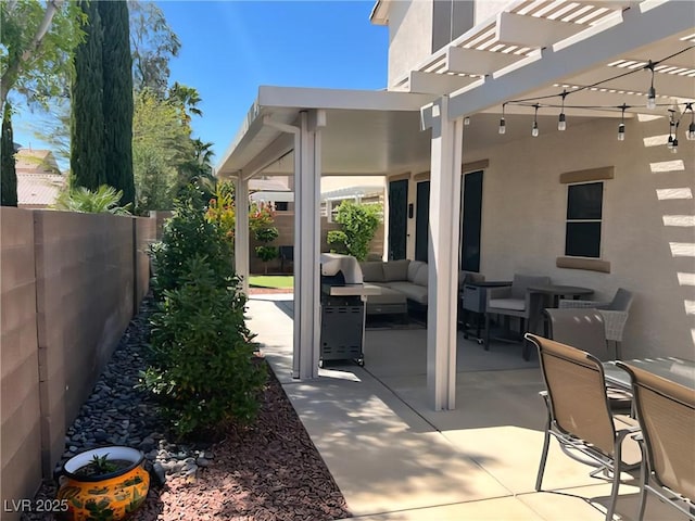 fenced backyard featuring an outdoor living space, a pergola, and a patio