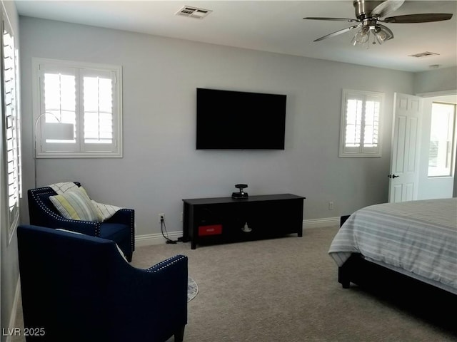 carpeted bedroom featuring baseboards and ceiling fan