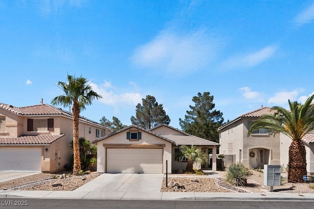 688 Castlebridge Ave, Las Vegas, NV 89123 - mediterranean / spanish-style home featuring stucco siding, driveway, a garage, and a tile roof