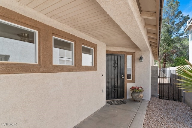 688 Castlebridge Ave, Las Vegas, NV 89123 - view of exterior entry featuring stucco siding and a gate