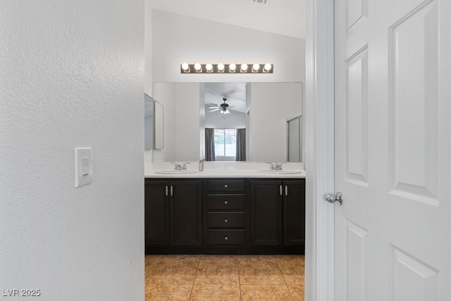 688 Castlebridge Ave, Las Vegas, NV 89123 - full bath with a ceiling fan, double vanity, tile patterned floors, and a textured wall