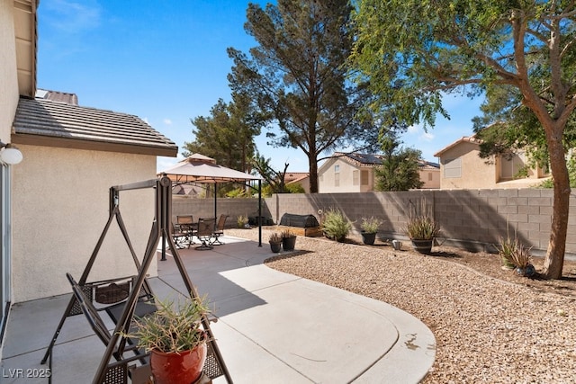 688 Castlebridge Ave, Las Vegas, NV 89123 - view of patio with a gazebo, a fenced backyard, and outdoor dining space
