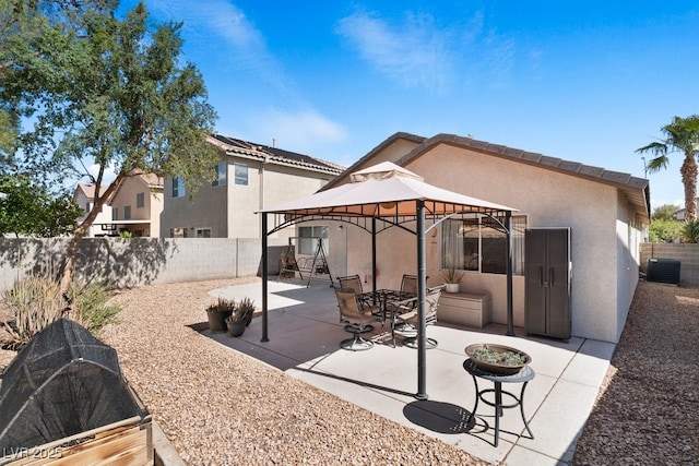 688 Castlebridge Ave, Las Vegas, NV 89123 - view of patio with a gazebo, a fenced backyard, and central air condition unit