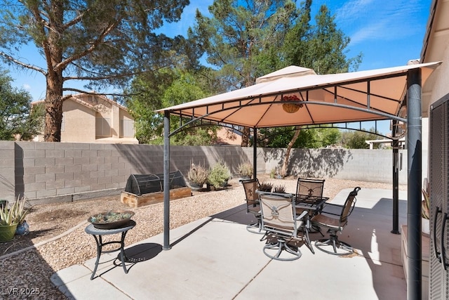 688 Castlebridge Ave, Las Vegas, NV 89123 - view of patio with a gazebo, a fenced backyard, and outdoor dining area