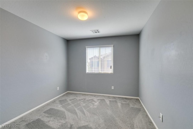 spare room with carpet floors and baseboards