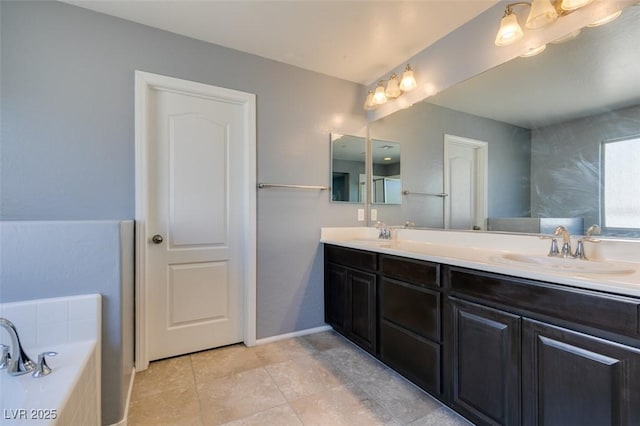 bathroom featuring double vanity and a bathtub