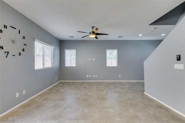 unfurnished room featuring a ceiling fan, baseboards, and recessed lighting