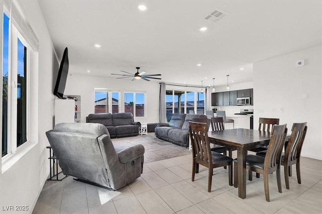dining area featuring ceiling fan, recessed lighting, and light tile patterned floors