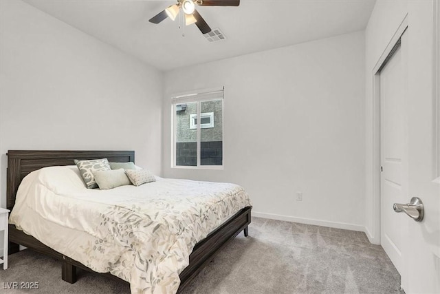 bedroom featuring carpet, baseboards, and a ceiling fan
