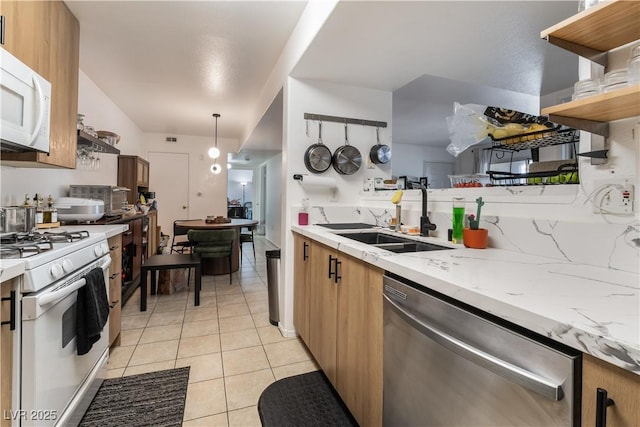 7885 W Flamingo Rd Unit 1161, Las Vegas, NV 89147 - kitchen featuring white appliances, a sink, open shelves, light tile patterned floors, and pendant lighting