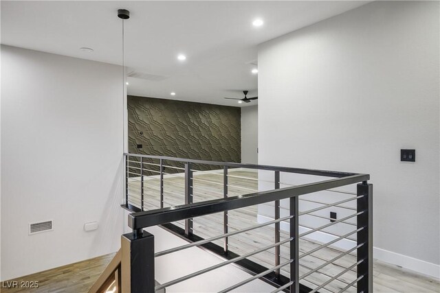 stairs featuring recessed lighting, wood finished floors, a ceiling fan, and baseboards