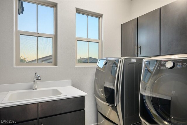 laundry room with cabinet space and washing machine and clothes dryer