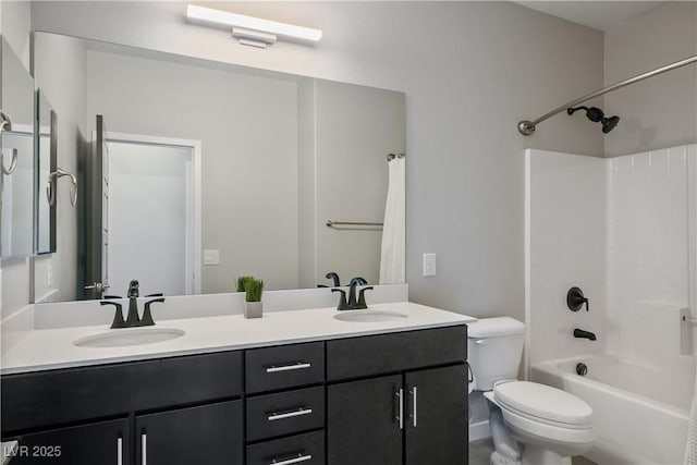 bathroom featuring toilet, double vanity, and shower / bath combo with shower curtain