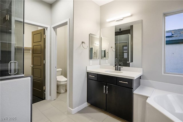 bathroom with tile patterned floors, vanity, a bath, toilet, and a shower stall