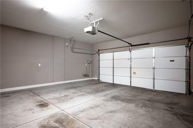 garage featuring baseboards and a garage door opener