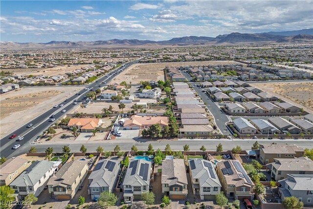 aerial view of residential area featuring a mountainous background