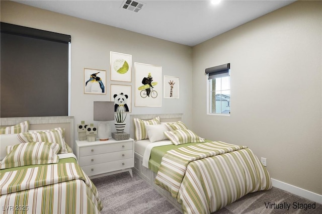 bedroom featuring carpet flooring and baseboards