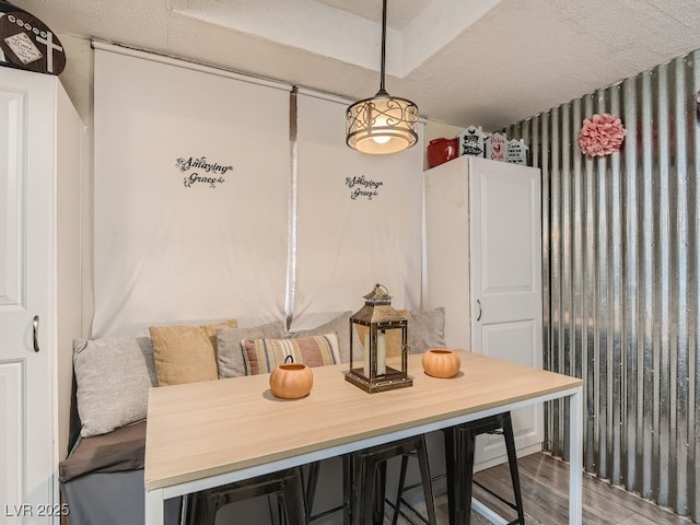 dining space with wood finished floors