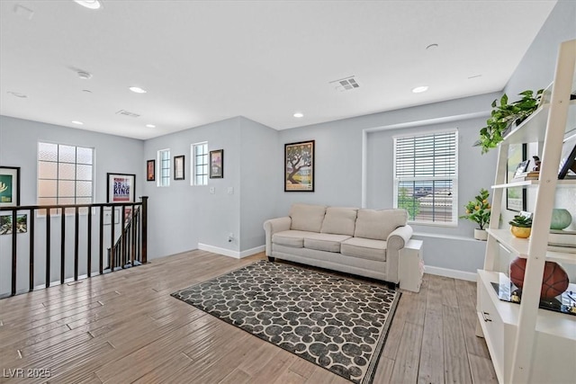 3171 Biccari Ave, Henderson, NV 89044 - living area with healthy amount of natural light, light wood-style floors, and recessed lighting