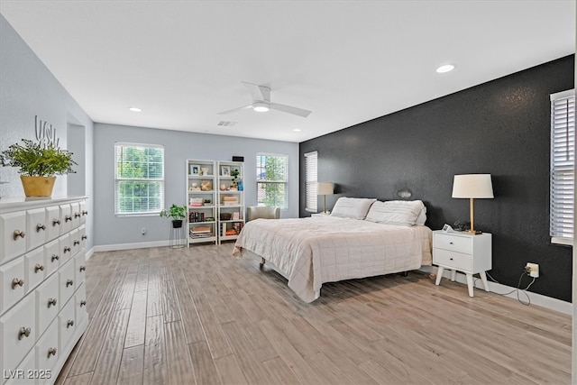 3171 Biccari Ave, Henderson, NV 89044 - bedroom featuring baseboards, light wood-style flooring, recessed lighting, a ceiling fan, and an accent wall