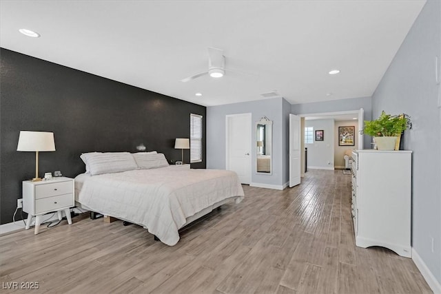 3171 Biccari Ave, Henderson, NV 89044 - bedroom featuring light wood-style flooring, an accent wall, baseboards, recessed lighting, and a ceiling fan