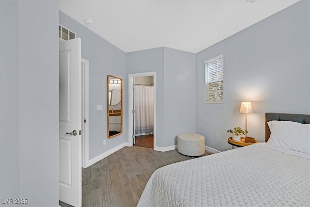 3171 Biccari Ave, Henderson, NV 89044 - bedroom featuring wood finished floors, baseboards, and ensuite bath