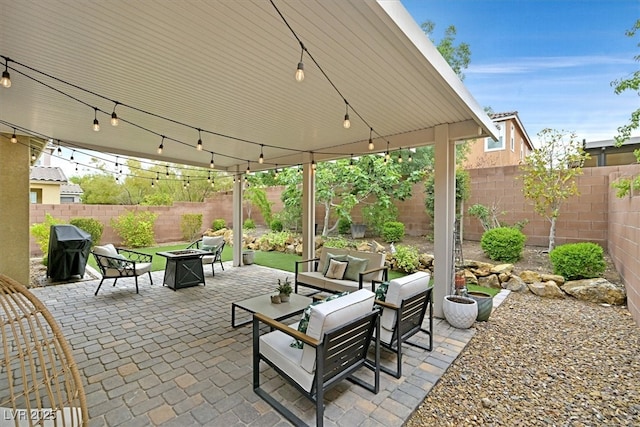 3171 Biccari Ave, Henderson, NV 89044 - view of patio / terrace with a fenced backyard, an outdoor living space with a fire pit, and grilling area