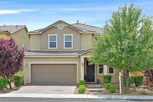3171 Biccari Ave, Henderson, NV 89044 - view of front of house with a garage, stucco siding, driveway, and a tile roof