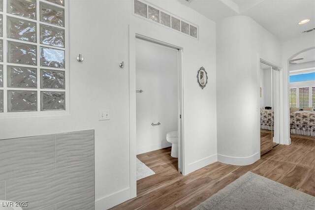 9916 Netherton Dr, Las Vegas, NV 89134 - ensuite bathroom featuring wood finished floors, toilet, and baseboards