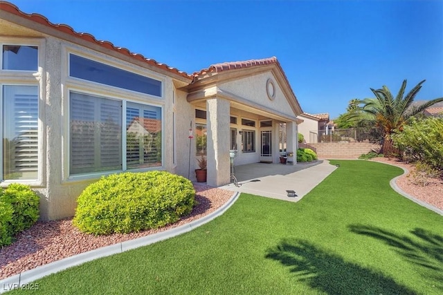 9916 Netherton Dr, Las Vegas, NV 89134 - rear view of house with stucco siding, a patio, and a tiled roof