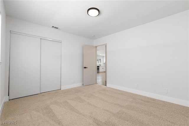 4450 San Rafael Ave, Las Vegas, NV 89120 - unfurnished bedroom with carpet flooring, baseboards, and a closet