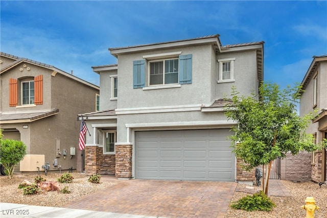 1267 Dorado Sea Ct, Henderson, NV 89052 - traditional-style home featuring a garage, decorative driveway, stone siding, and stucco siding