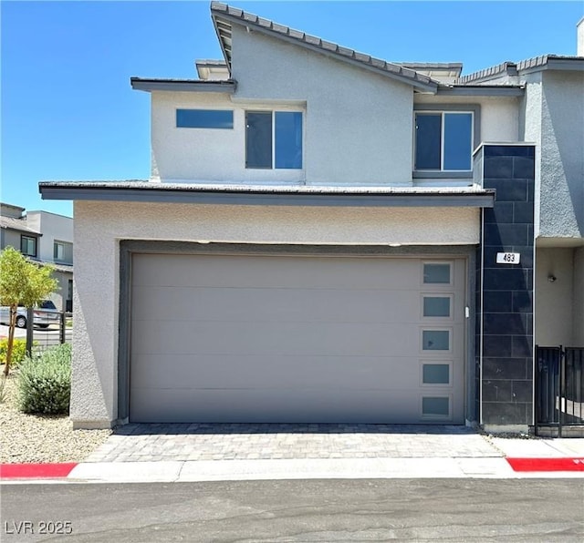 483 Fairview Hills St, Las Vegas, NV 89138 - view of front of property with stucco siding and a garage