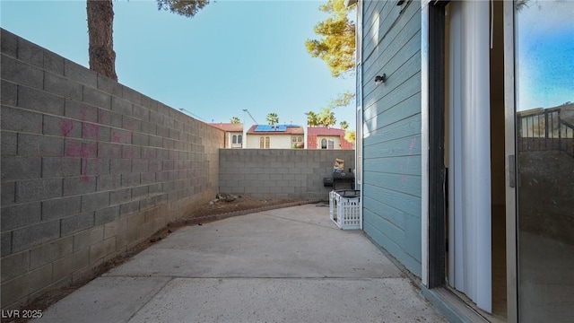 view of home's exterior featuring a patio and a fenced backyard