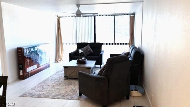 living area with ceiling fan