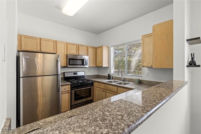 5250 S Rainbow Blvd Unit 2106, Las Vegas, NV 89118 - kitchen featuring stainless steel appliances, a sink, a peninsula, and dark stone counters