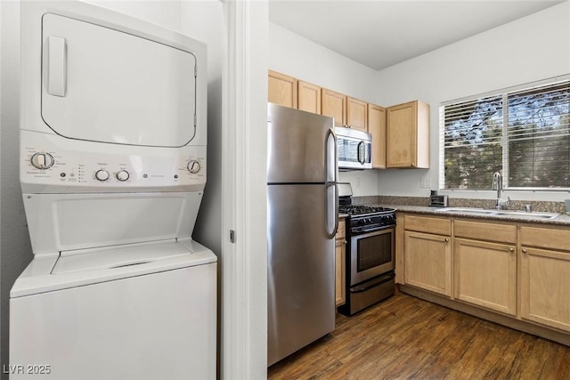 5250 S Rainbow Blvd Unit 2106, Las Vegas, NV 89118 - kitchen featuring stainless steel appliances, a sink, estacked washer and dryer, dark wood finished floors, and light brown cabinetry