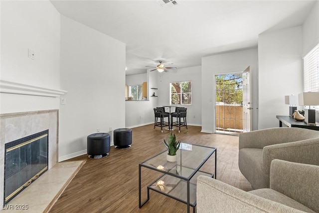 5250 S Rainbow Blvd Unit 2106, Las Vegas, NV 89118 - living area featuring wood finished floors, healthy amount of natural light, and a ceiling fan