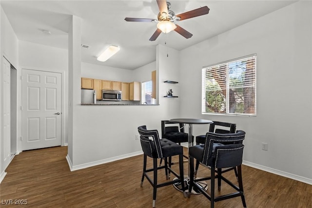 5250 S Rainbow Blvd Unit 2106, Las Vegas, NV 89118 - dining area with plenty of natural light, dark wood-style flooring, baseboards, and ceiling fan