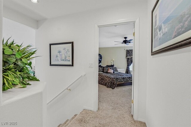 hallway featuring light carpet and recessed lighting